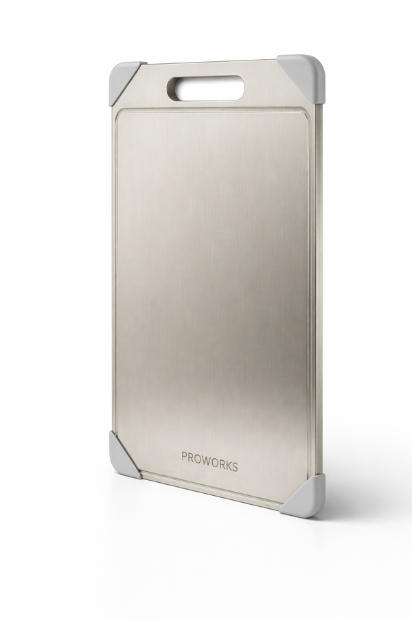 Beige cutting board with silver handle and frame on a white background